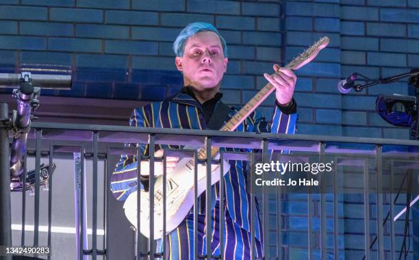 Jack White performs from a balcony on Marshall Street to crowds of people following his in store performance and opening of Third Man Records Store...