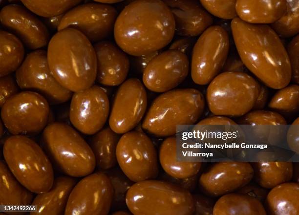 chocolate covered almonds - chocolate dipped stock pictures, royalty-free photos & images