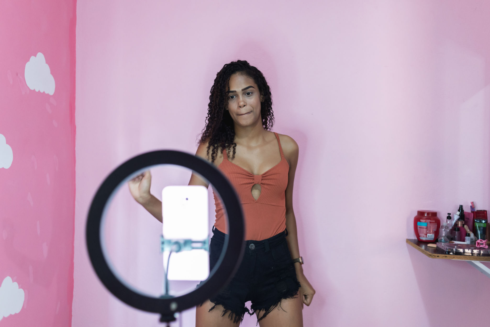 Black young woman filming herself dancing at home to share on social media Black young woman filming herself dancing at home to share on social media