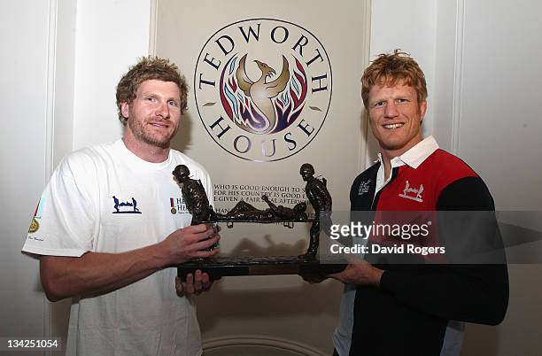 Adam Thomson captain of the Southern Hemisphere team and Hugh Vyvyan, captain of the Northern Hemisphere team hold the Help for Heroes Challenge...