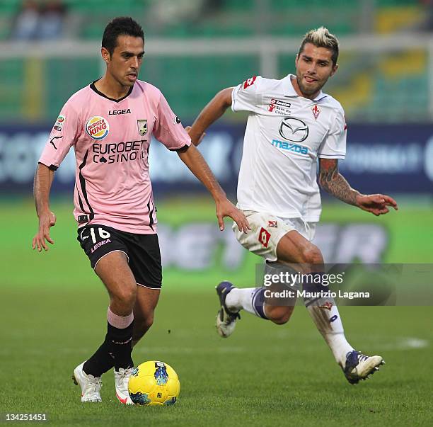 Eran Zahravi of Palermo competes for the ball with Valon Behrami of Fiorentina during the Serie A match between US Citta di Palermo and ACF...