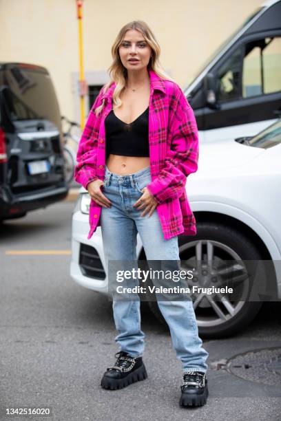 Veronica Ferraro outside Philosophy fashion show wearing pink checkered jacket, jeans and black cropped top during the Milan Fashion Week - Spring /...