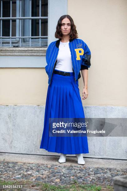 Erika Boldrin outside Philosophy fashion show wearing a long pleated blue skirt and a baseball striped blue jacket during the Milan Fashion Week -...