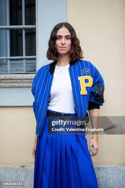 Erika Boldrin outside Philosophy fashion show wearing a long pleated blue skirt and a baseball striped blue jacket during the Milan Fashion Week -...