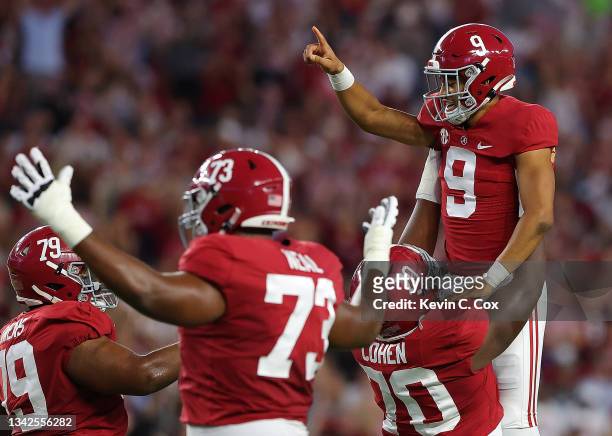Bryce Young of the Alabama Crimson Tide reacts after passing for a touchdown against the Southern Miss Golden Eagles during the first half at...