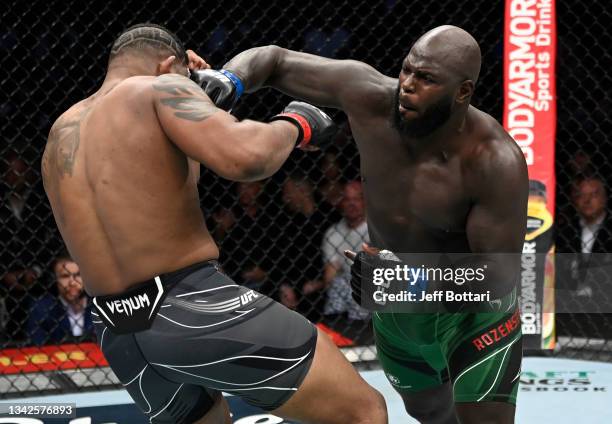 Jairzinho Rozenstruik of Suriname punches Curtis Blaydes in their heavyweight fight during the UFC 266 event on September 25, 2021 in Las Vegas,...