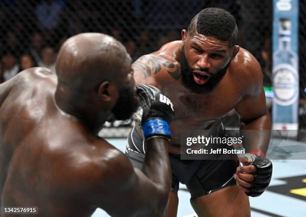 Curtis Blaydes punches Jairzinho Rozenstruik of Suriname in their heavyweight fight during the UFC 266 event on September 25, 2021 in Las Vegas,...