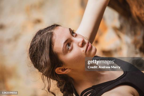 Girl Looking Over Rocks Woman Outdoor Rock Climber Looking Up Cliff High-Res Stock Photo ...
