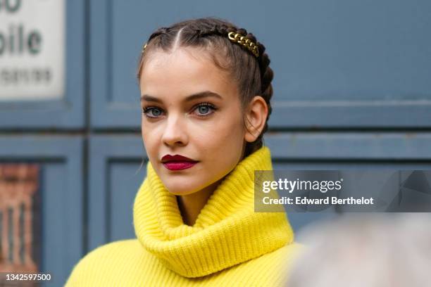 Barbara Palvin wears a gold chain hair clip, a yellow ribbed wool oversized pullover from Philosophy, outside the Philosophy fashion show during the...