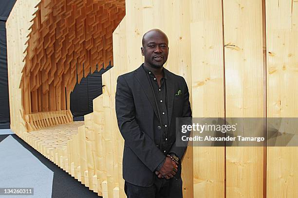 Portrait of David Adjaye with Genesis at the Miami Beach Convention Center on November 29, 2011 in Miami Beach, Florida.