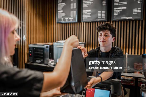 picking up curbside take out food in a cafe - picking up coffee stock pictures, royalty-free photos & images