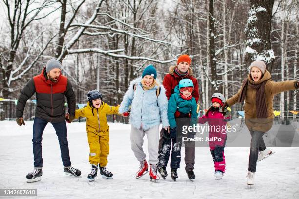 friends ice skating - family ice skate stock pictures, royalty-free photos & images