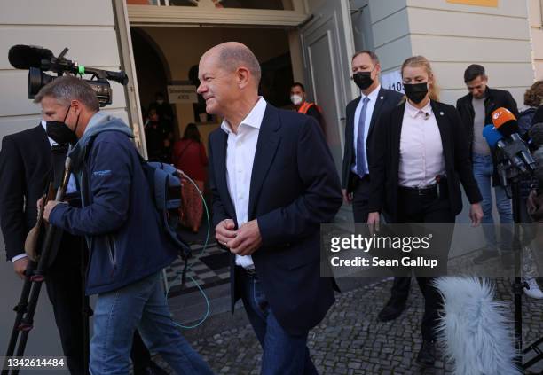 Olaf Scholz, chancellor candidate of the German Social Democrats , departs after casting his ballot in federal parliamentary elections on September...