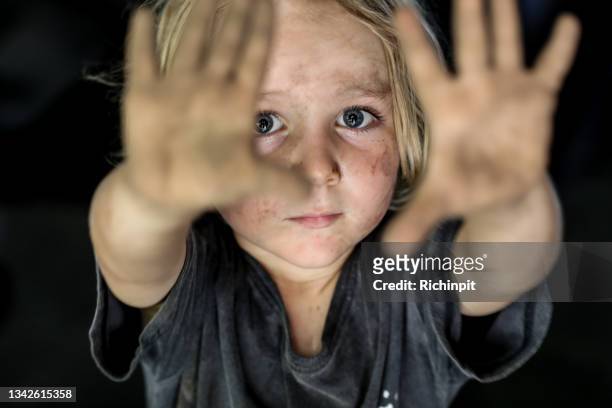 sad boy looking dirty - childhood hunger stock pictures, royalty-free photos & images