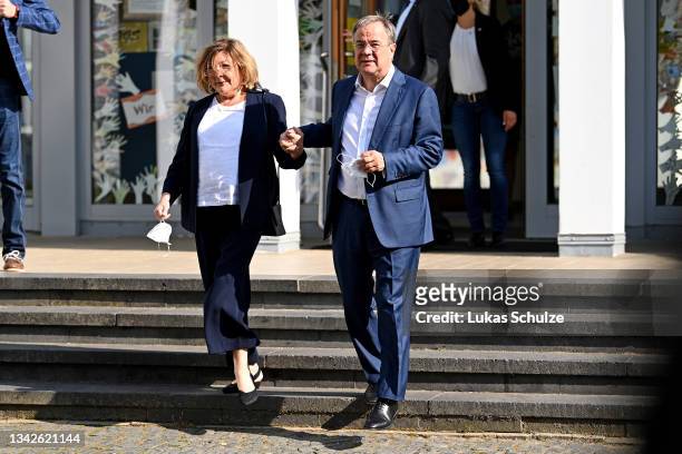 Armin Laschet, chancellor candidate of the union of German Christian Democrats and Bavarian Christian Democrats , and his wife Susanne Laschet leave...