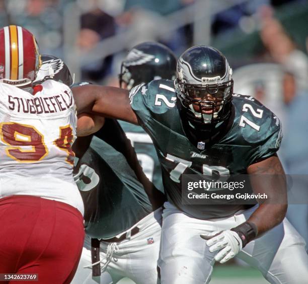 Offensive lineman Tra Thomas of the Philadelphia Eagles blocks against defensive lineman Dana Stubblefield of the Washington Redskins during a game...