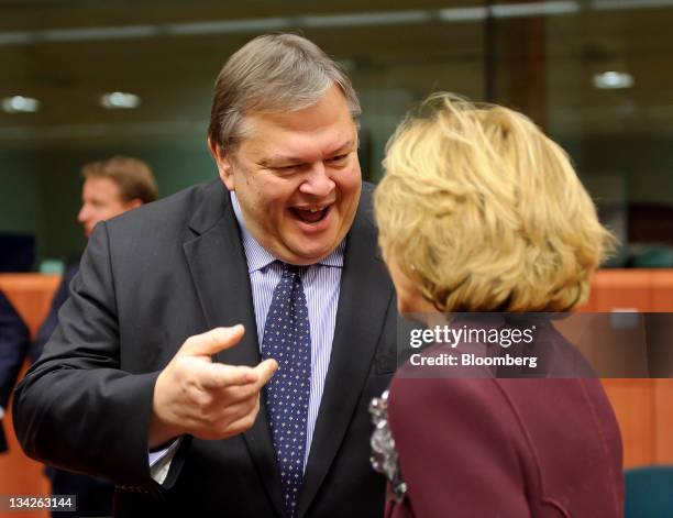 Evangelos Venizelos, Greece's finance minister, left, speaks with Elena Salgado, Spain's finance minister, during a Eurogroup finance ministers...