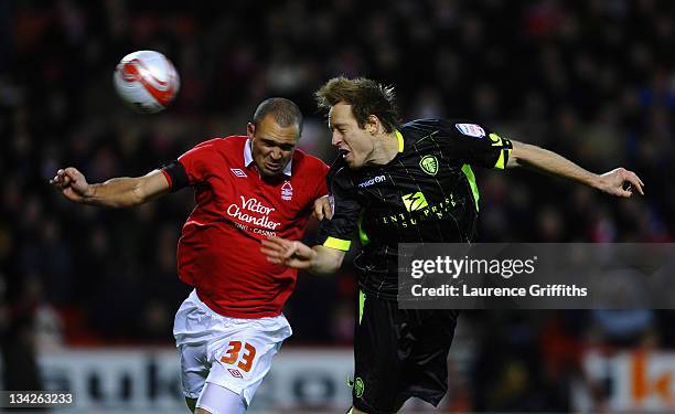 Luciano Becchio of Leeds United scores the third goal under pressure from Joel Lynch of Nottingham Forest during the npower Championship match...