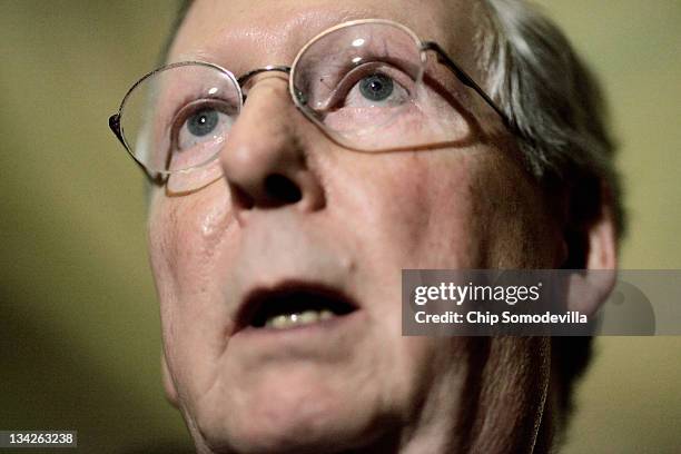 Senate Minority Leader Mitch McConnell answers reporters' questions after the weekly Senate Republican policy luncheon at the U.S. Capitol November...