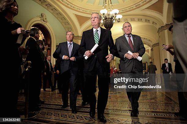 Sen. Lindsey Graham , Senate Minority Leader Mitch McConnell and U.S. Sen. Jon Kyl approach the microphones to talk to the press after the weekly...