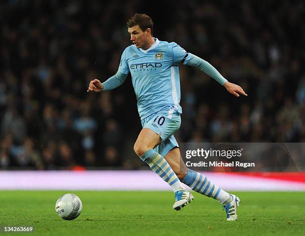 Edin Dzeko of Manchester City in action during the Carling Cup Quarter Final match between Arsenal and Manchester City at Emirates Stadium on...