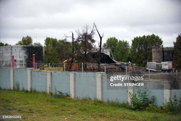 Burnt-out oil reservoirs are seen on the grounds of a fuel depot that was bombed during the Wagner mercenaries rebellion in Voronezh on June 27,...