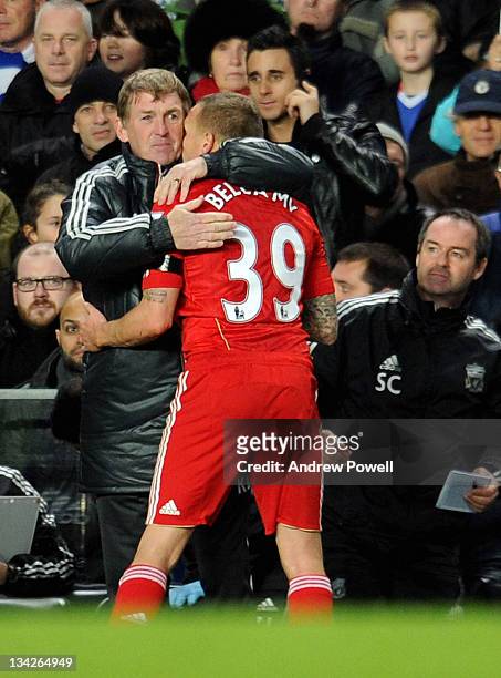 Kenny Dalglish manager of Liverpool hugs Craig Bellamy of Liverpool as he comes off during the Carling Cup quarter final between Chelsea and...
