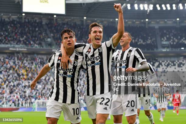 Paulo Dybala of Juventus celebrates after scoring his team's first goal with teammate Federico Chiesa during the Serie A match between Juventus and...