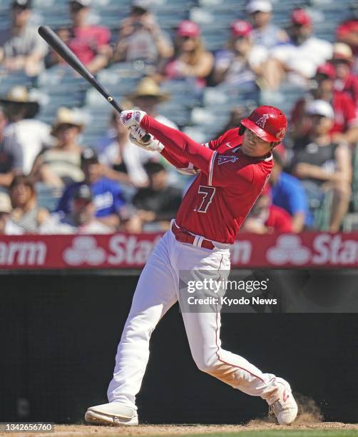 Shohei Ohtani of the Los Angeles Angels hits a two-run blast for his 29th homer of the season during the ninth inning of a baseball game against the...