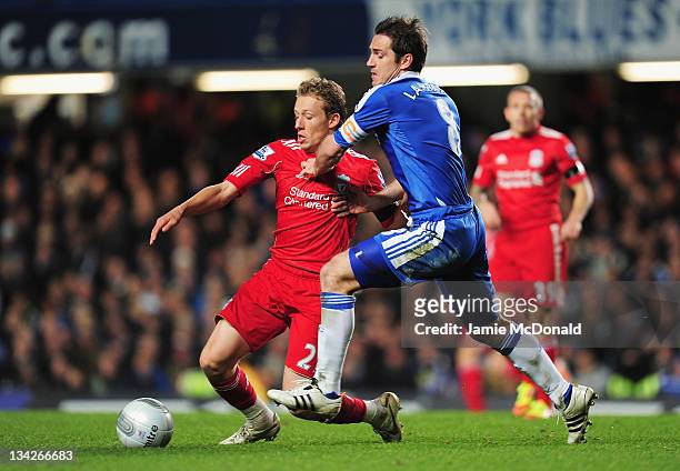 Frank Lampard of Chelsea challenges Lucas of Liverpool during the Carling Cup quarter final match between Chelsea and Liverpool at Stamford Bridge on...