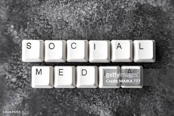 computer keyboard keys spelling the word social media on black background. - social media marketing stock pictures, royalty-free photos & images
