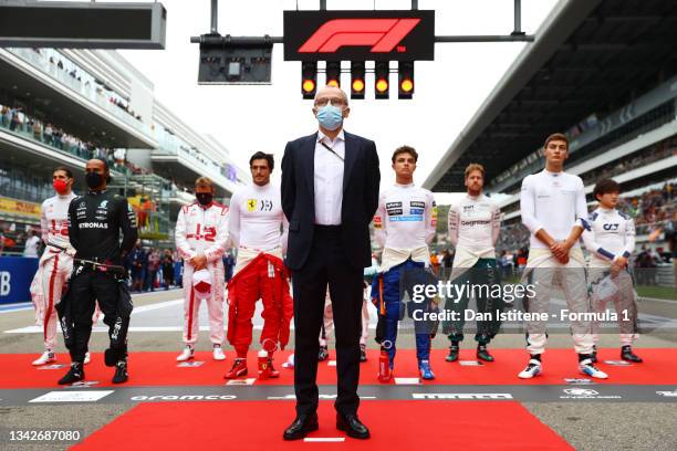 Stefano Domenicali, CEO of the Formula One Group, stands for the national anthem on the grid before the F1 Grand Prix of Russia at Sochi Autodrom on...