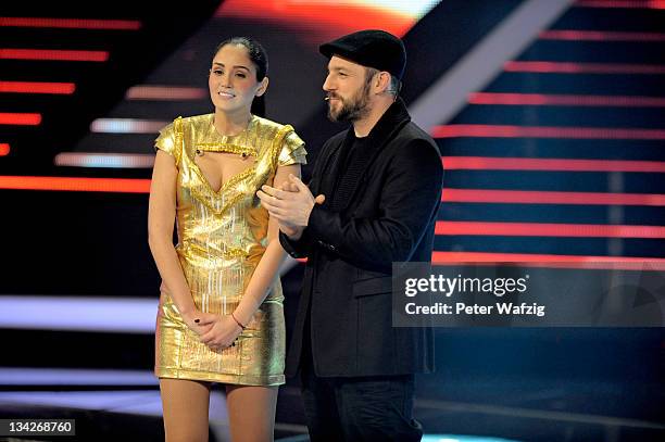 Raffaela Wais and jury member Mirko Bogojevic on stage during 'The X Factor Live' Semifinal TV-Show on November 29, 2011 in Cologne, Germany.