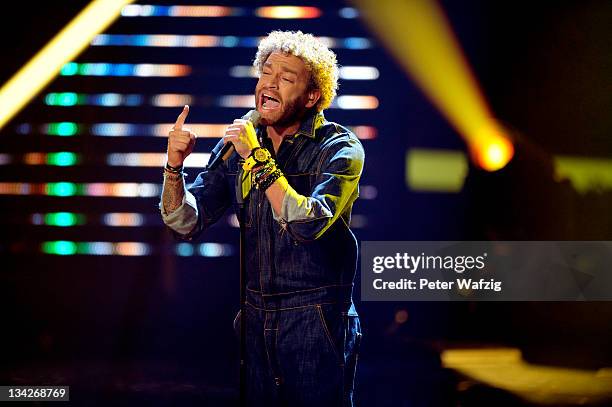 Rufus Martin performs his first song on stage during 'The X Factor Live' Semifinal TV-Show on November 29, 2011 in Cologne, Germany.