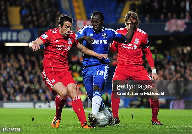 Romelu Lukaku of Chelsea is closed down by Jose Enrique and Sebastian Coates of Liverpool during the Carling Cup quarter final match between Chelsea...