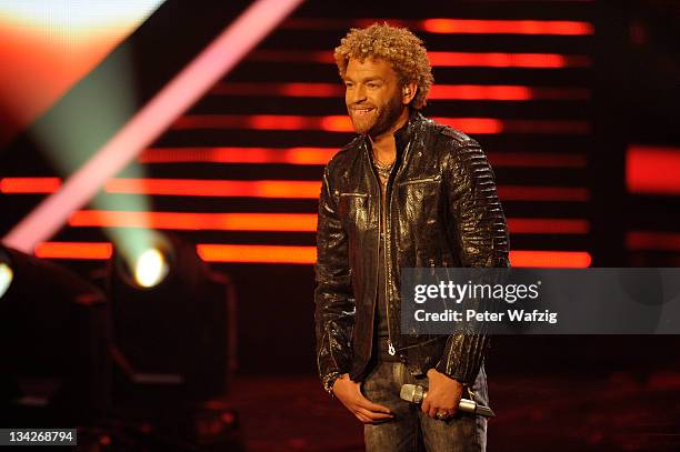 Rufus Martin listens to the jury during 'The X Factor Live' Semifinal TV-Show on November 29, 2011 in Cologne, Germany.