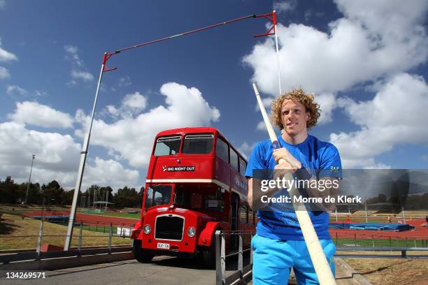 Australian pole vaulter Steve Hooker poses in front of a bus showing the height of the crossbar set to the height he cleared to win the gold medal in...