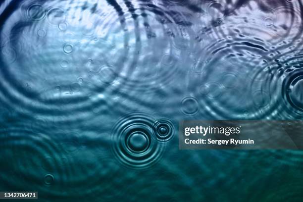 ripples on water surface - wateroppervlak stockfoto's en -beelden