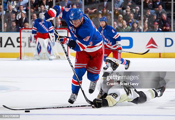 Marian Gaborik of the New York Rangers skates in the first period against Tyler Kennedy of the Pittsburgh Penguins at Madison Square Garden on...