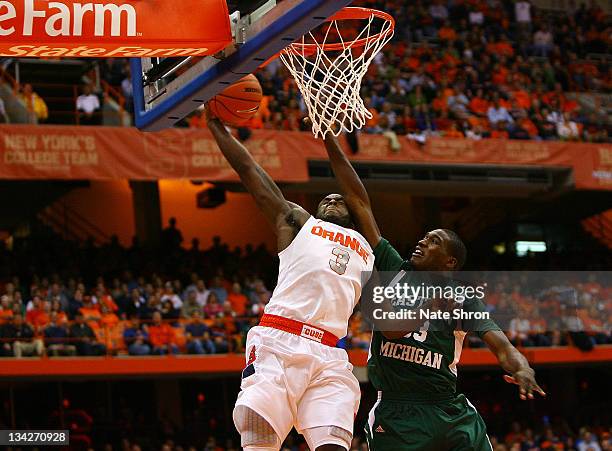 Dion Waiters of the Syracuse Orange reaches to the basket against Anthony Strickland of the Eastern Michigan Eagles during the game at the Carrier...