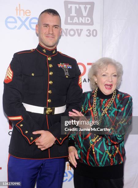 Staff Sgt Eric Worth and actress Betty White attend the TV Land holiday premiere party for "Hot in Cleveland" & "The Exes" at SD26 on November 29,...