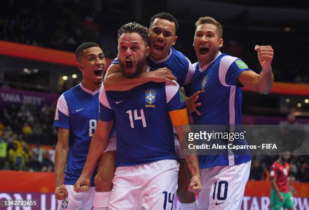 Rodrigo of Brazil celebrates after scoring their sides first goal with team mates Leonardo, Dieguinho and Pito during the FIFA Futsal World Cup 2021...