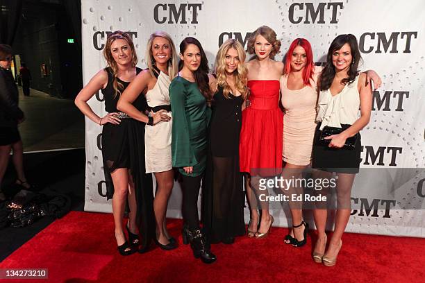 Shelsea Linkes, Brooklyn Goddel, Marisha Weaver, Shantello Paige, Taylor Swift, Charity Baroni and Elizabeth Huett attend CMT Artists of the Year...