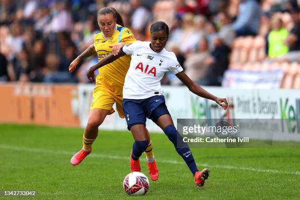 Natasha Harding of Reading is challenged by Jessica Naz of Tottenham Hotspur during the Barclays FA Women's Super League match between Tottenham...