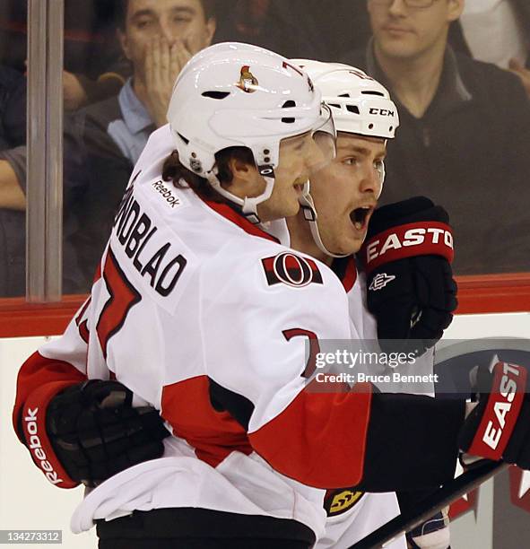 David Rundblad and Zack Smith of the Ottawa Senators celebrate the game winning power play goal by Smith at 13:45 of the third period against the...