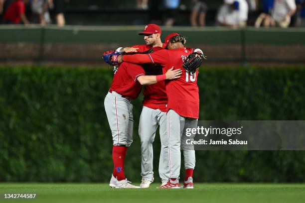 Brandon Marsh, Nick Castellanos and Cristian Pache of the Philadelphia Phillies celebrate after defeating the Chicago Cubs 3-1 at Wrigley Field on...