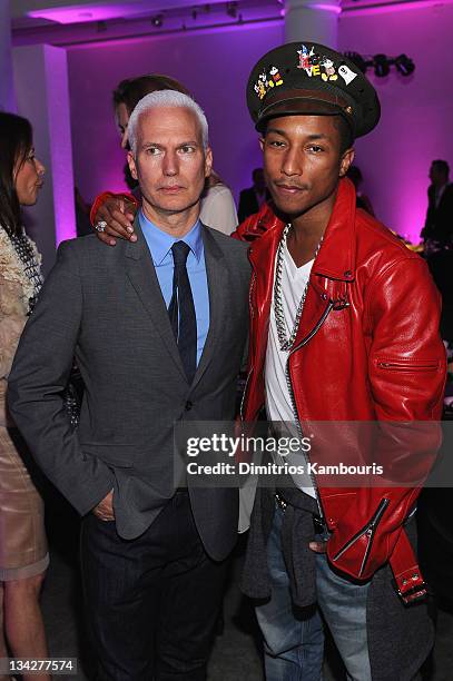 Klaus Biesenbach and Pharrell Williams visit the Dior pop-up shop featuring Anselm Reyle for Dior at Miami Design District on November 29, 2011 in...