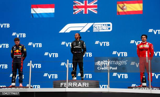 Race winner Lewis Hamilton of Great Britain and Mercedes GP, second placed Max Verstappen of Netherlands and Red Bull Racing and third placed Carlos...