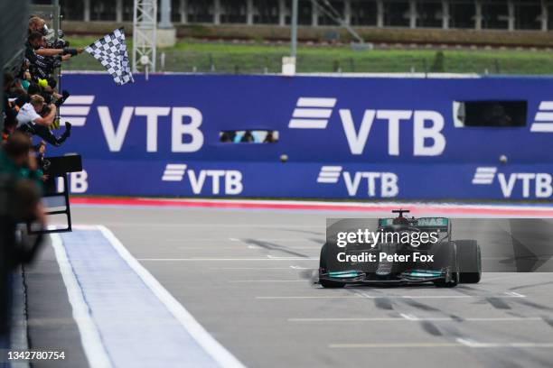 Lewis Hamilton of Mercedes and Great Britain wins his 100th Grand Prix during the F1 Grand Prix of Russia at Sochi Autodrom on September 26, 2021 in...