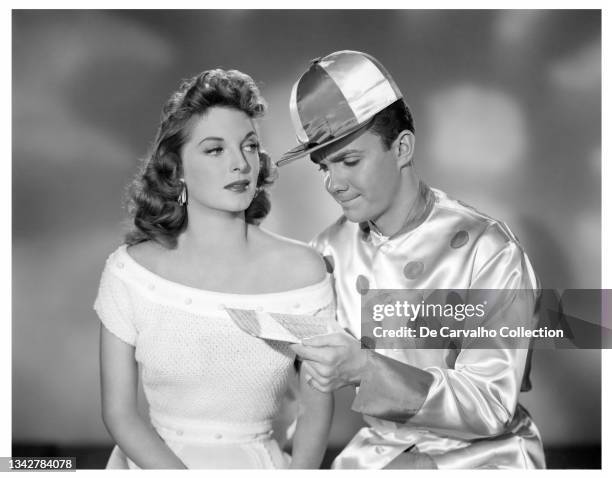 Actress and Singer Julie London as 'Janet Wales' and Actor Ben Cooper dressed as a jockey as 'Mike Gargan' in a publicity shot from the movie 'The...